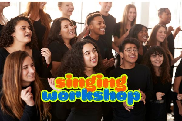 older children dressed in black singing