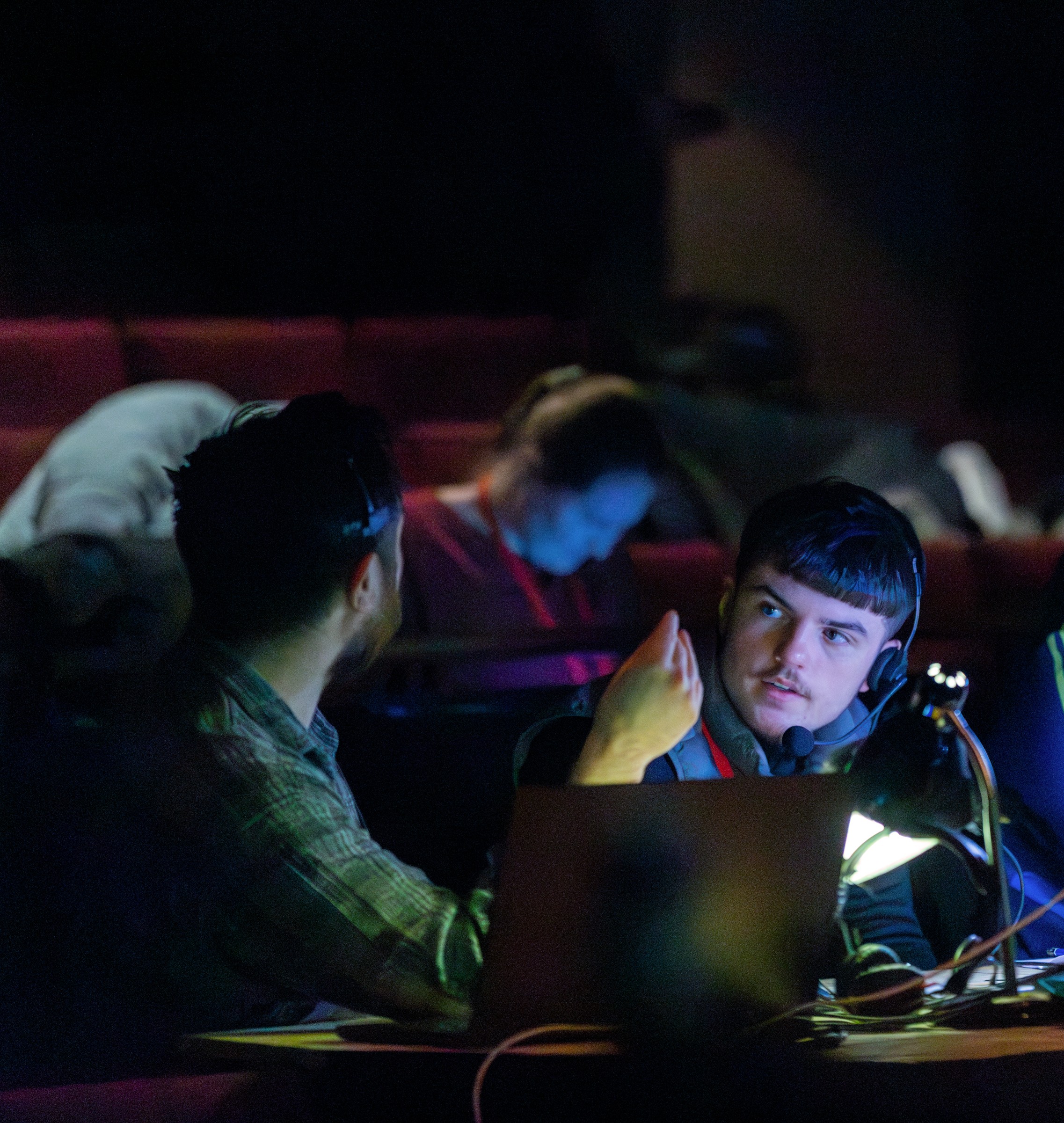 coventry student working in the tech box with staff at a theatre