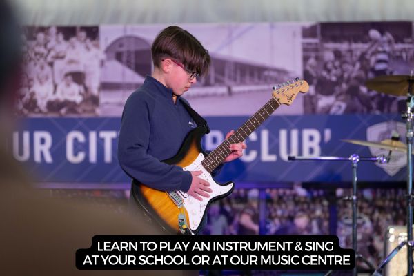 boy playing an electric guitar